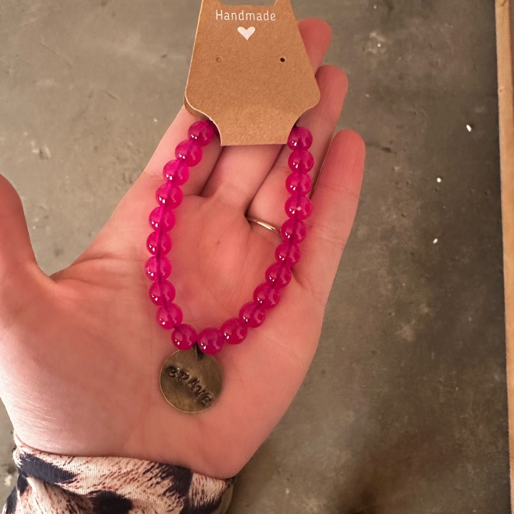 Handmade Pink Beaded Bracelet with Brave Charm